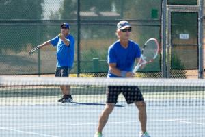 two men playing tennis
