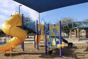 Playground monkey bars and slide at Centennial Park