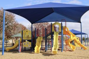 Playground with four slides and climbing features at Chuckwalla Park