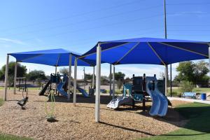 Play Area With Slides And Climbing Features At Gazelle Meadows Park