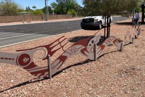 Landscape maintenance hardscape with a serpent display.