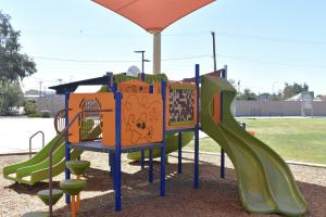 Play structure with slides and steps at Harris Park