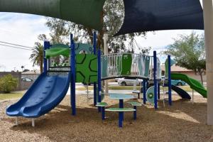 Playground With Slides And Climbing Features At Park Manors Park