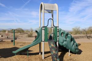 Play structure with climbing wall and slide at Paseo Vista Recreation Area