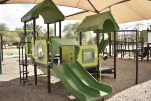 Playground with double slide and music player at Pecos Ranch Park