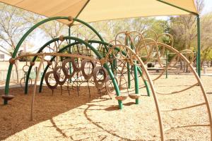 Playground climbing structure at Pine Shadows Park