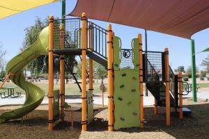 Playground slide and climbing wall at San Tan Park