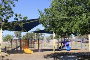 Play area with slides and swings at Stonegate Park