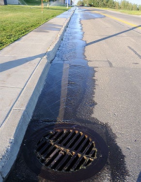 Water Running Off the Sidewalk into the Street