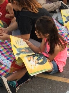 Young girl reading a book